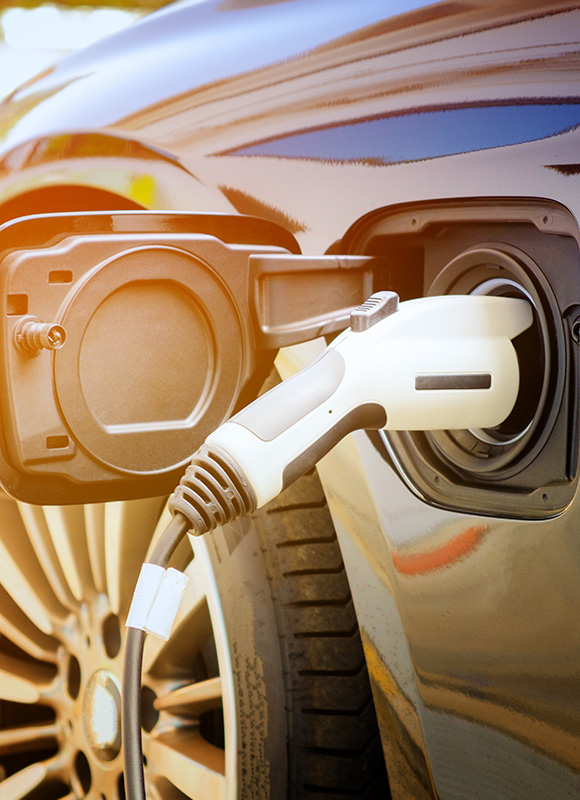 electric vehicle charging station close up with charging cable plugged into car showcasing sustainable energy options for 8 electric models